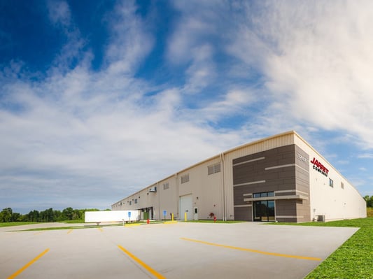 a semi-truck sitting idle outside of a Jarrett warehouse