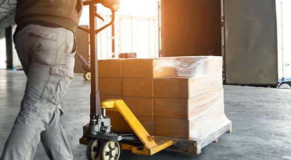 Man loading packages into truck