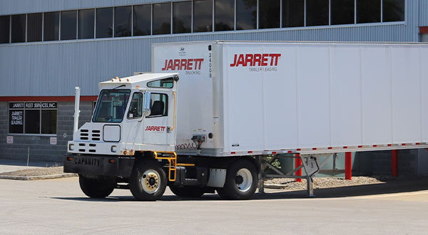 Jarrett truck parked outside of a warehouse