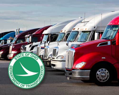 Row of semi-trucks at Jarrett Fleet Services getting DOT inspection in Northeast Ohio for State of Ohio Department of Transportation