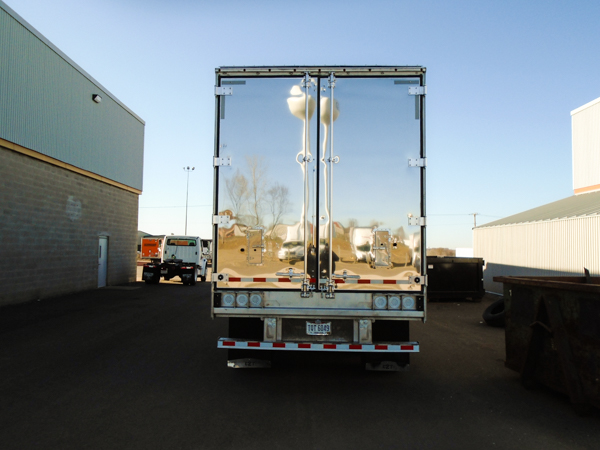 Rear view of semi-truck trailer door that was repaired by Jarrett Fleet Services and then painted