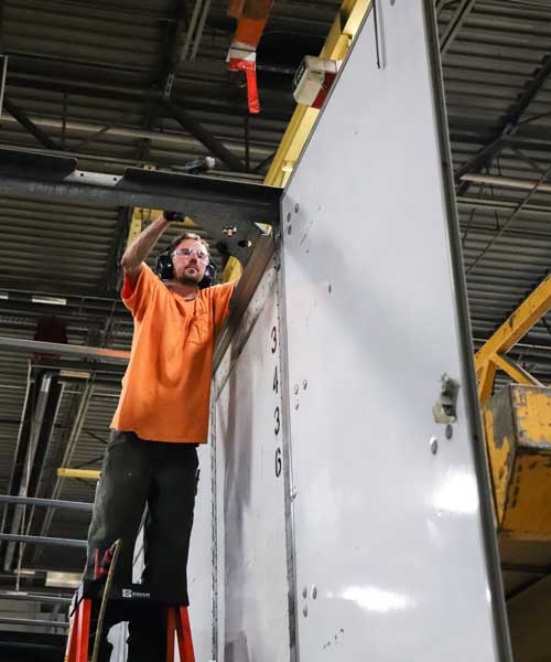 Jarrett Fleet Services DOT compliance expert and technician repairing semi-truck trailer to meet DOT safety compliance