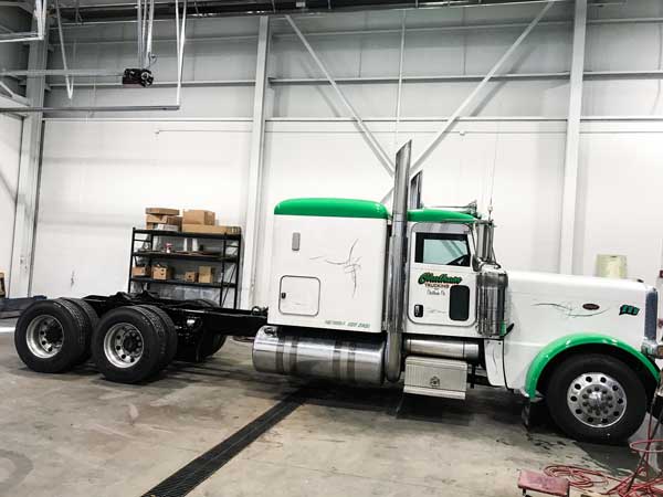 Side view of semi-truck that had trailer body work done by Jarrett Fleet Services