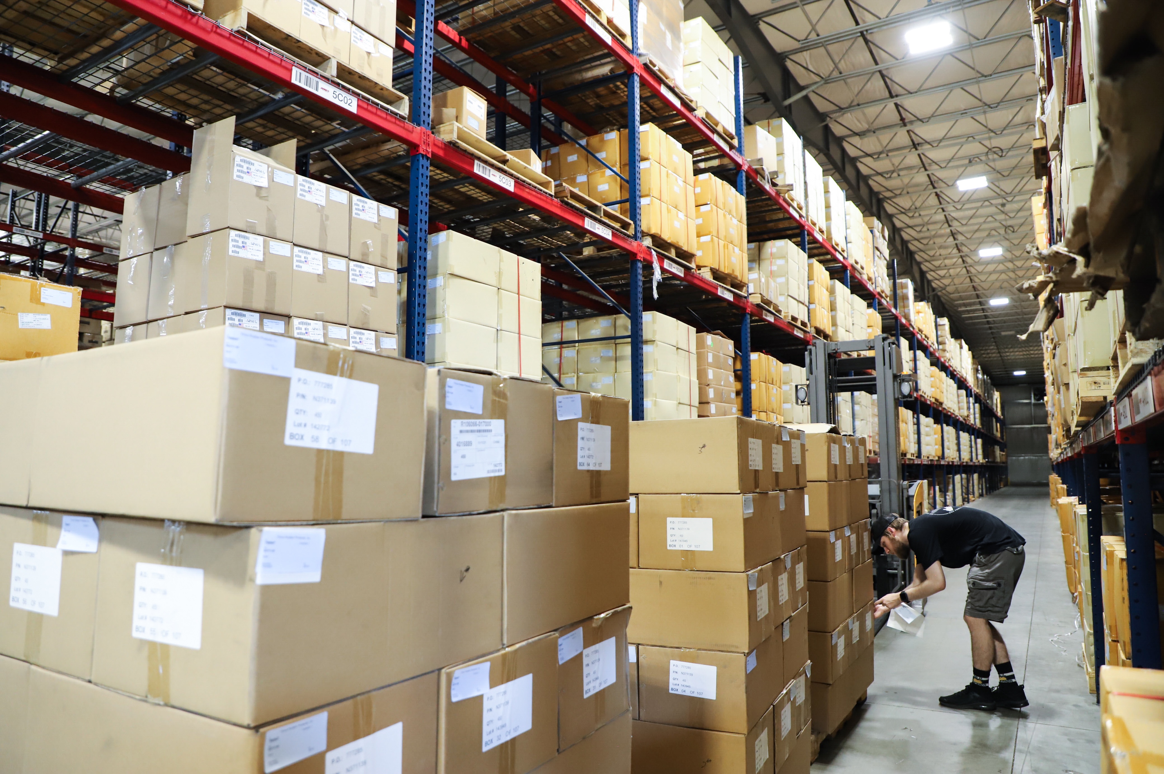 Jarrett employee inspects shipments and boxes in the Jarrett Warehouse