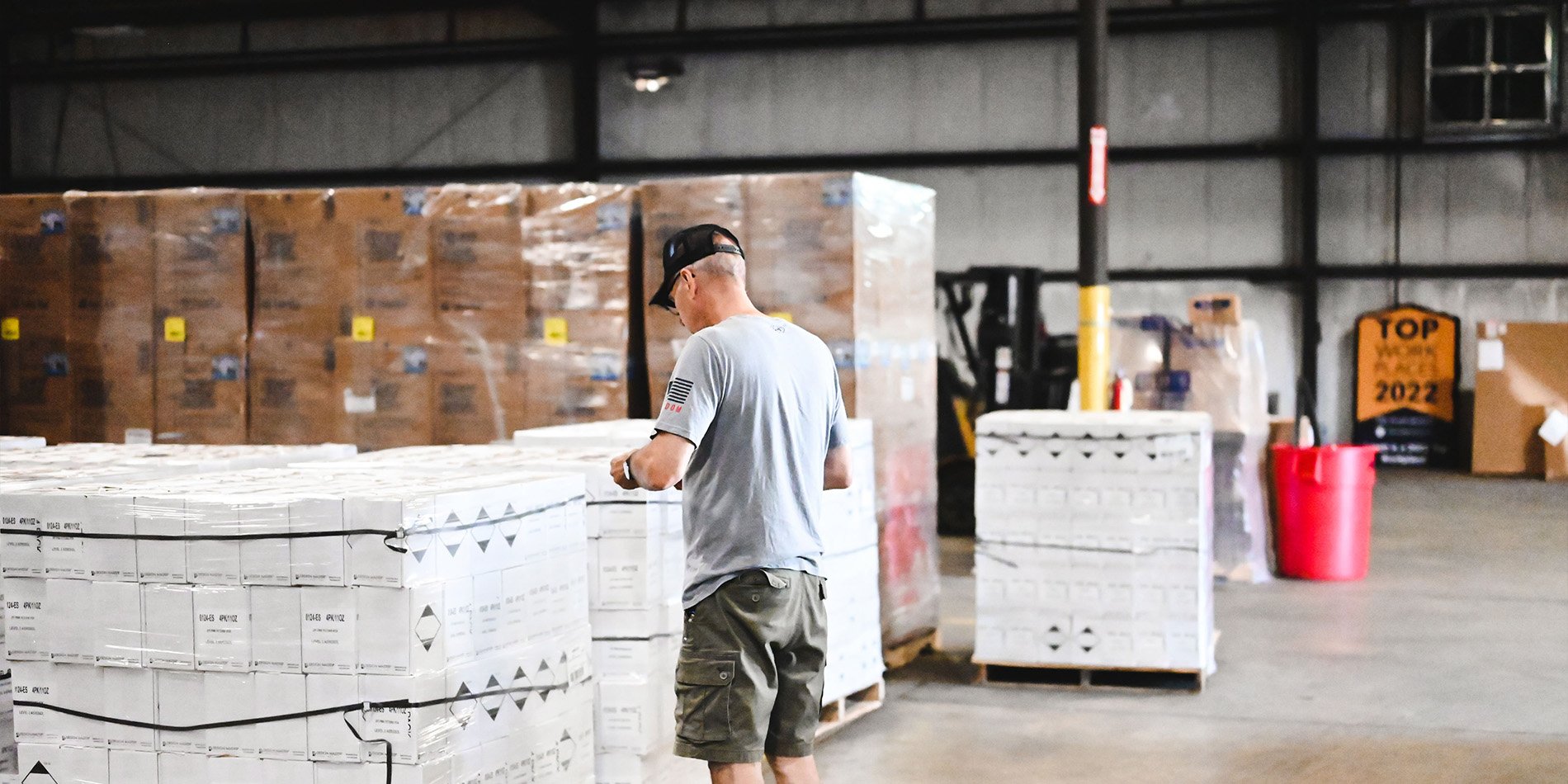 Jarrett employee checks pallets of freight in a Jarrett warehouse